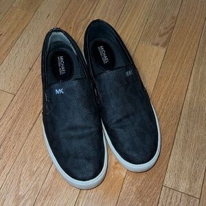 - Michael Kors Women’s Keaton Logo Slip-On Sneaker